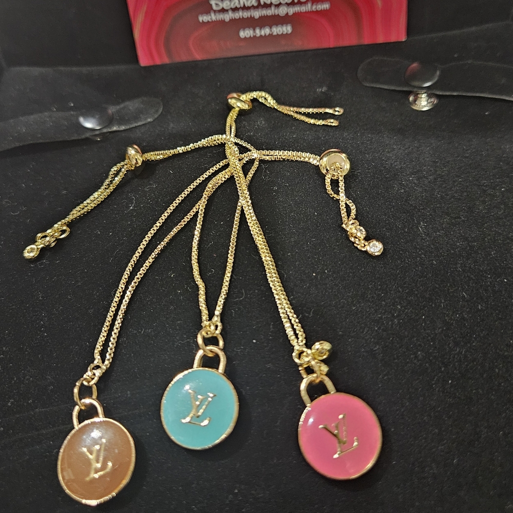Louis Vuitton Gold Bracelets with LV Charm
